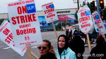 Boeing books charges and warns on revenue and profit