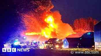 Crews work to contain fire in farm building
