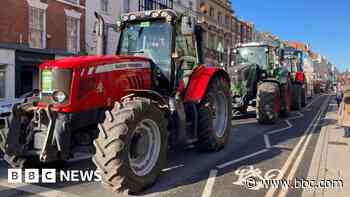 Farmers drive tractor convoy in tax protest