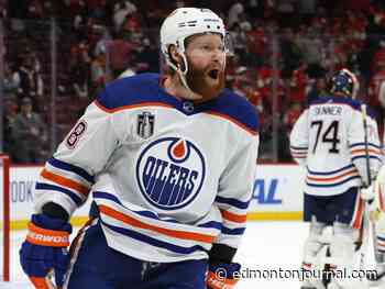 Duck! Paul Coffey takes it on the chin in Oilers practice