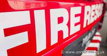Streetlight attached to property in York catches fire