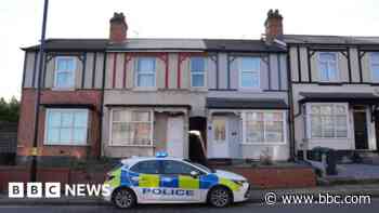 Murder arrests after man found at house