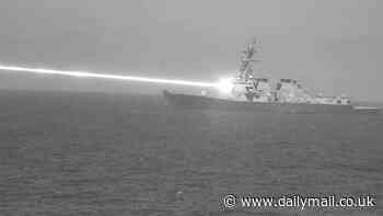 Incredible images capture US Navy testing its new laser weapon that NEVER runs out of power