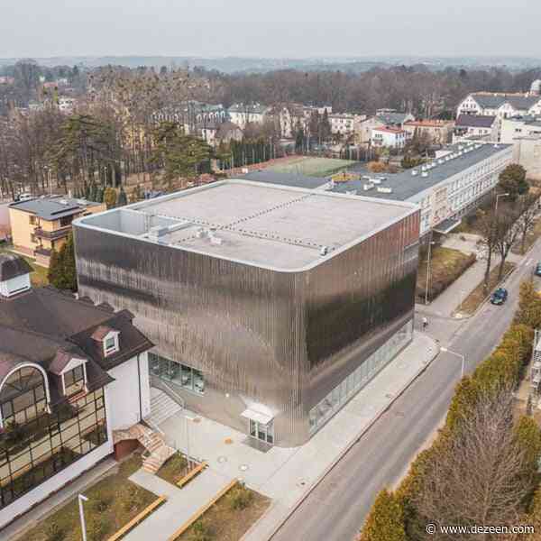 SLAS Architekci wraps Polish concert hall in mirror-like steel facade