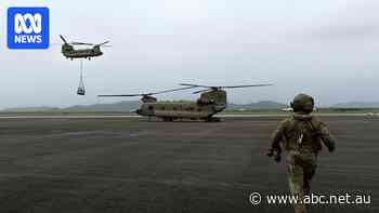 Food, medical supplies running low as floods spark panic buying in Queensland