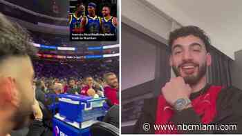 WATCH: Heat fan breaks news of Jimmy Butler trade to teammates during game