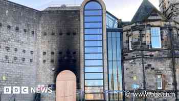 Person charged over fire at court building