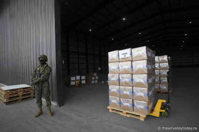 Polls open in Ecuador with conservative incumbent and leftist lawyer leading the presidential race