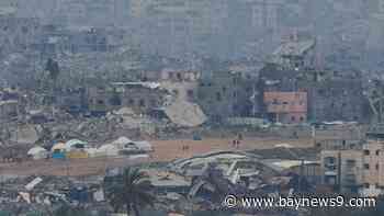 Israeli forces withdraw from a key Gaza corridor as violence surges in West Bank