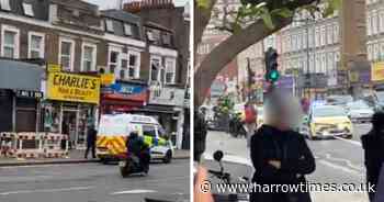 Man taken to hospital after stabbing near busy west London station
