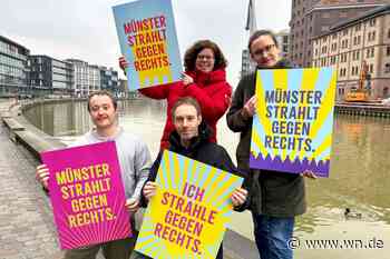 Mit Leuchtplakaten gegen dunkle Zeiten