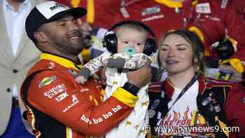 Wallace celebrates his first win at Daytona with his newborn son