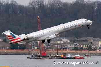 Helicopter crew in collision with plane may not have heard key instruction from tower, NTSB says