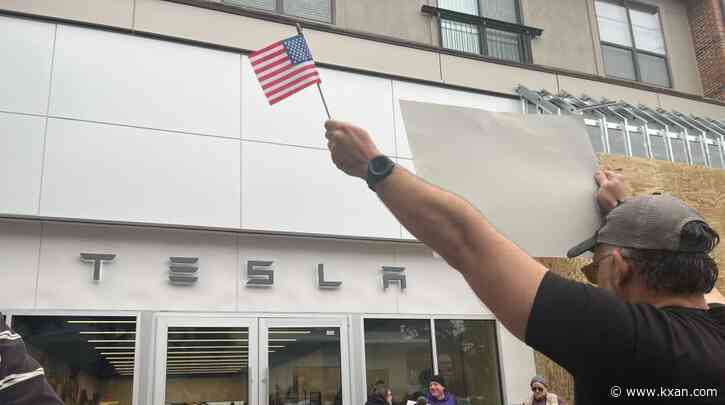 Protesters gather outside Austin-area Tesla store
