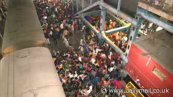At least 15 people killed in 'stampede' at Indian railway station after passengers rush for delayed trains to religious festival