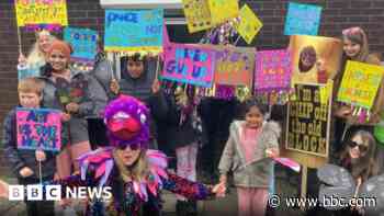 Community gathers as new mascot unveiled in parade