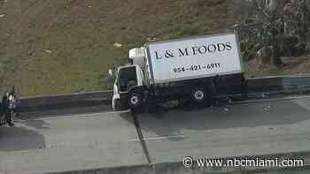 WATCH: Video shows box truck tipped over on Miami Gardens Drive at I-75