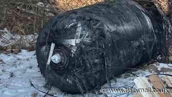 Warehouse owner in Poland is left BAFFLED after finding a huge piece of a SpaceX rocket in his back garden