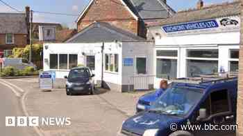 Village fights plan to build homes on garage site