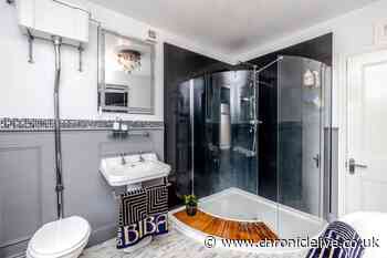 Inside Northumberland home for sale with unique stained glass window and grand staircase