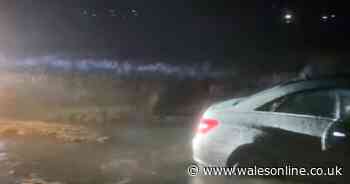 Two cars become 'well and truly stuck' on notorious Welsh beach