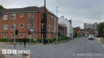 Car crashing into flats sparks police search