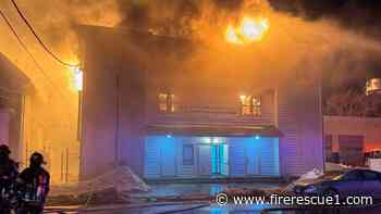 Mass. 5-alarm fire destroys apartment building and church