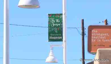 Officials say holiday banners along Central Ave. in Albuquerque are being taken down