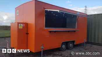 Search on for big orange food truck taken from layby