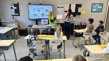 Leerlingen Dick Bruna Waddinxveen leren hondentaal en geven cheque