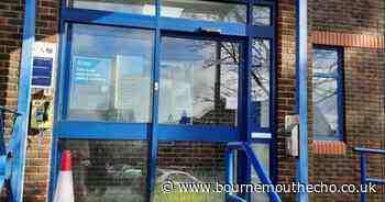 Yellow paint splashed over police station door