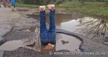 Frustrated dad sticks fake legs in huge pothole