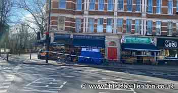 Woman dies as Holloway Road cordoned by police