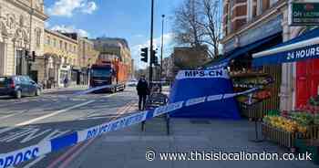 Forensics tent set in Holloway Road as woman dies - recap