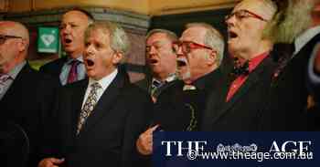 ‘Like men’s shed with singing’: Men in Suits in full voice on city streets