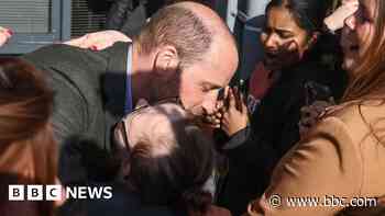 Prince William hugs student on visit to college