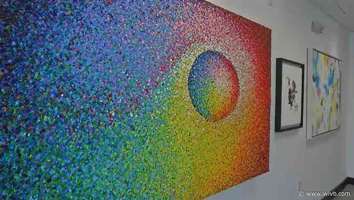 Viral painter opens gallery in Williamsville, hopes to attract artists worldwide