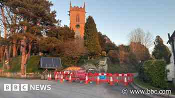 Road closed after debris falls on to carriageway