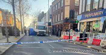 Multiple cordons in place with blue tent erected after woman killed in Hackney crash