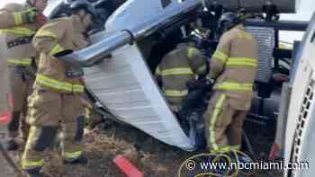 Driver hospitalized after semi-tractor trailer rolls over on Alligator Alley