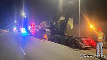 Truck hauling logging equipment damages 34th Street overpass on Sherwood Park Freeway
