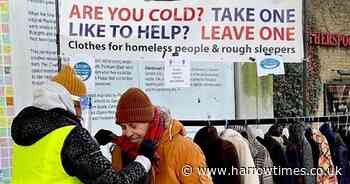 Death of homeless man inspires boy to set up 'take one. leave one' clothes rail