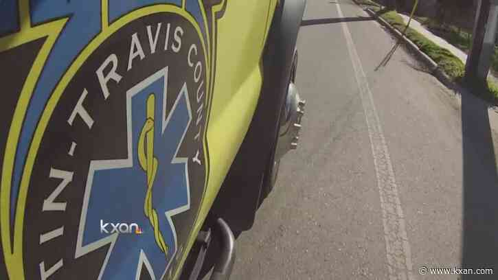 First responders work to extricate pinned patient after rollover