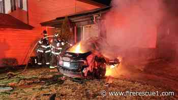 Tesla crashes into Ill. house, killing 2, causing fire