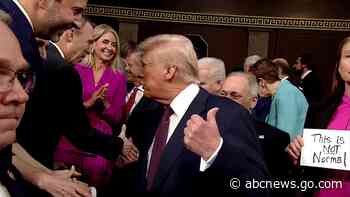 WATCH:  Republican takes 'This is not normal' sign out of Democrat's hands