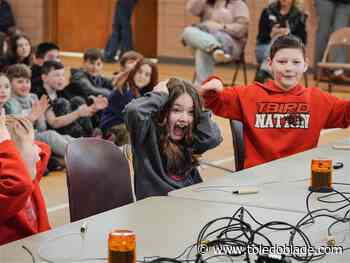 Fifth-grade students school teachers in quiz bowl competition