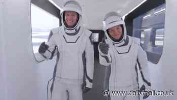 Four-man NASA rescue crew give thumbs up as they prepare to be swapped with stranded astronauts