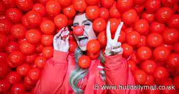 Massive red ball pit encourages adults to rediscover fun with a twist