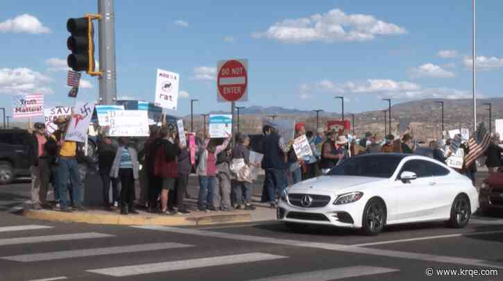 Protestors demonstrate outside Tesla dealership in Bernalillo