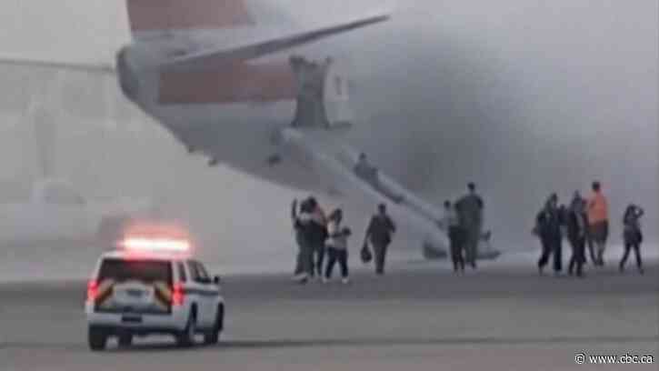 175 passengers evacuated as American Airlines plane catches fire